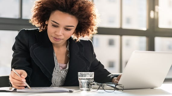 women sitting in front of a desk